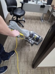 PRO-SEC technician professionally cleaning residential carpet